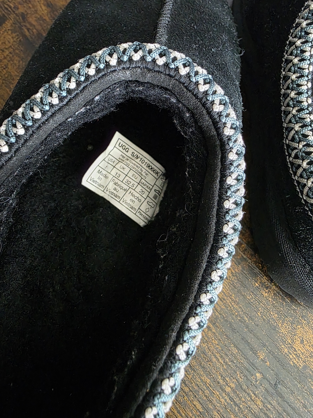 UGG Girl's Black Slip-On Moccasin with Braided Trim
